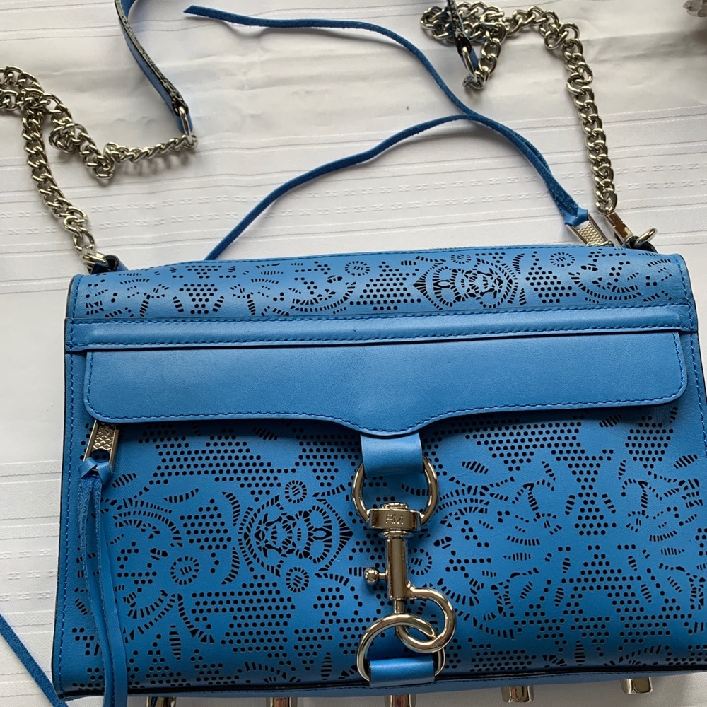Cross body bag with embossed decoration